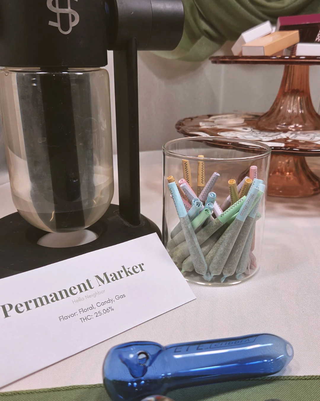 colorful pre-rolls with a stundenglass and glass serving pieces
